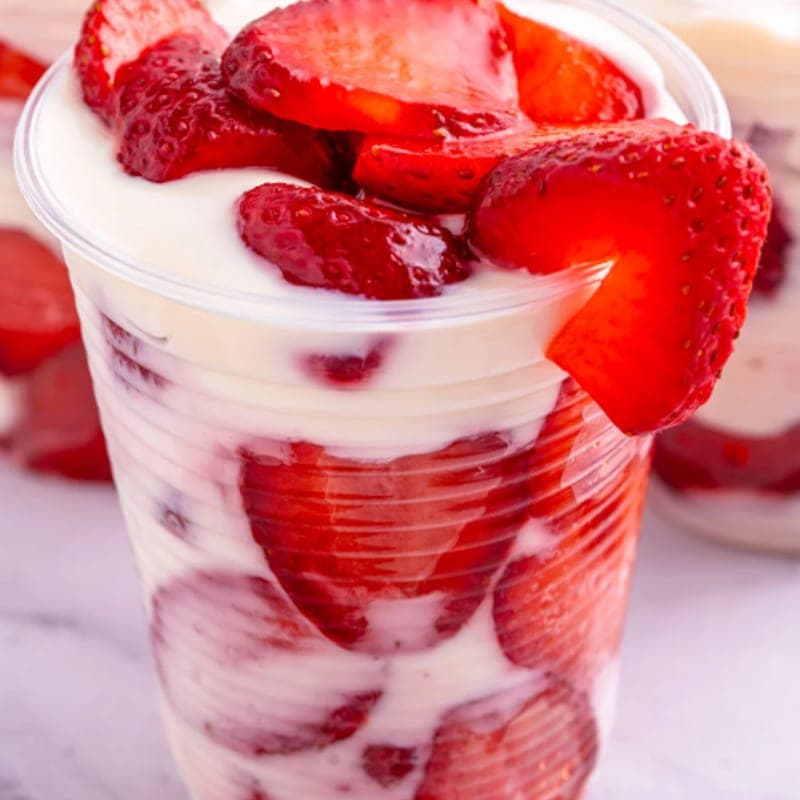 A giant piece of chicharrón and fresas con crema at Supermercados Talpa — Norcross